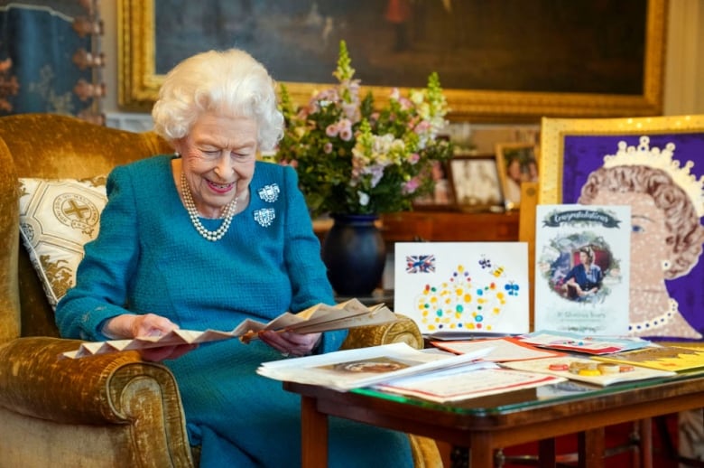 Queen Elizabeth looks with 'hope and optimism' to Platinum Jubilee that comes amid uncertainty, family strife